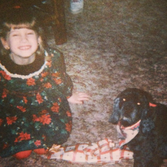 That’s me on that Christmas cheesin’ in a poinsettia dress with my aunt’s dog Princess