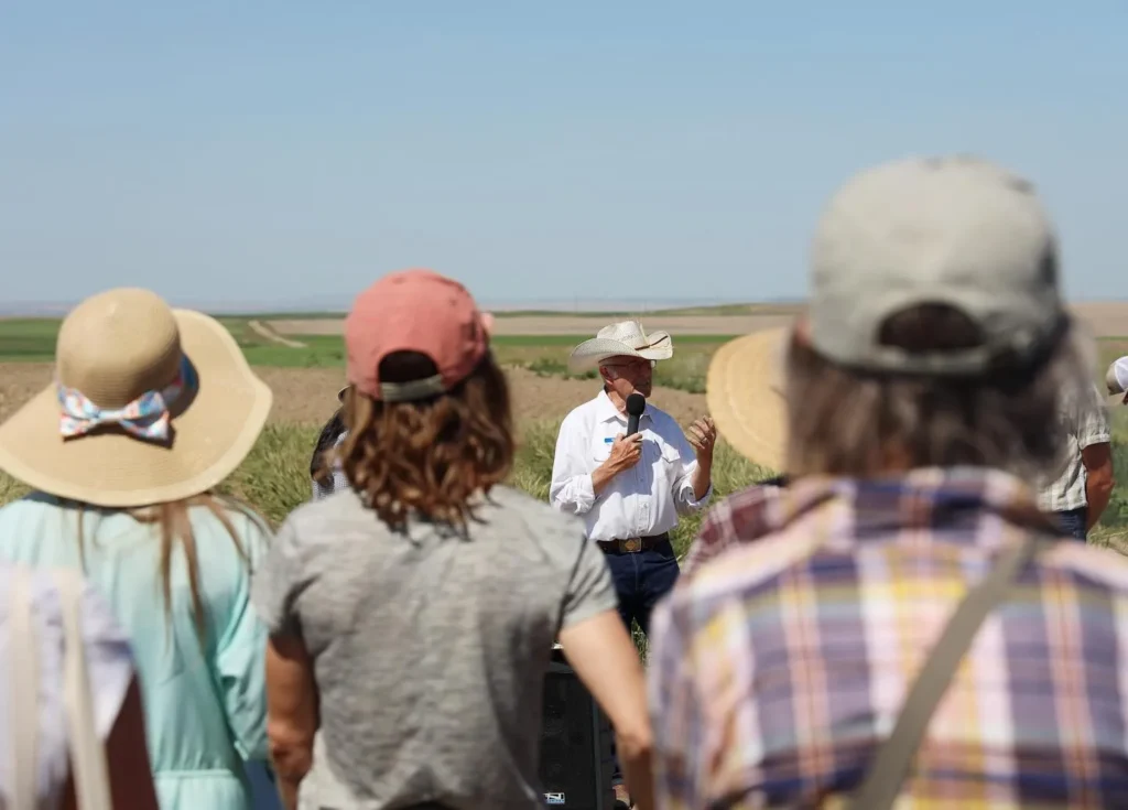 Bob Quinn speaking to a group of visitors attending a field day on the Quinn Institute farmland.